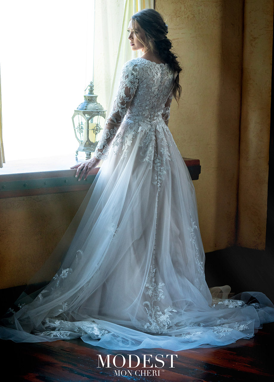 Mon Cheri TR11972 Modest Wedding Dress Back from A Closet Full of Dresses
