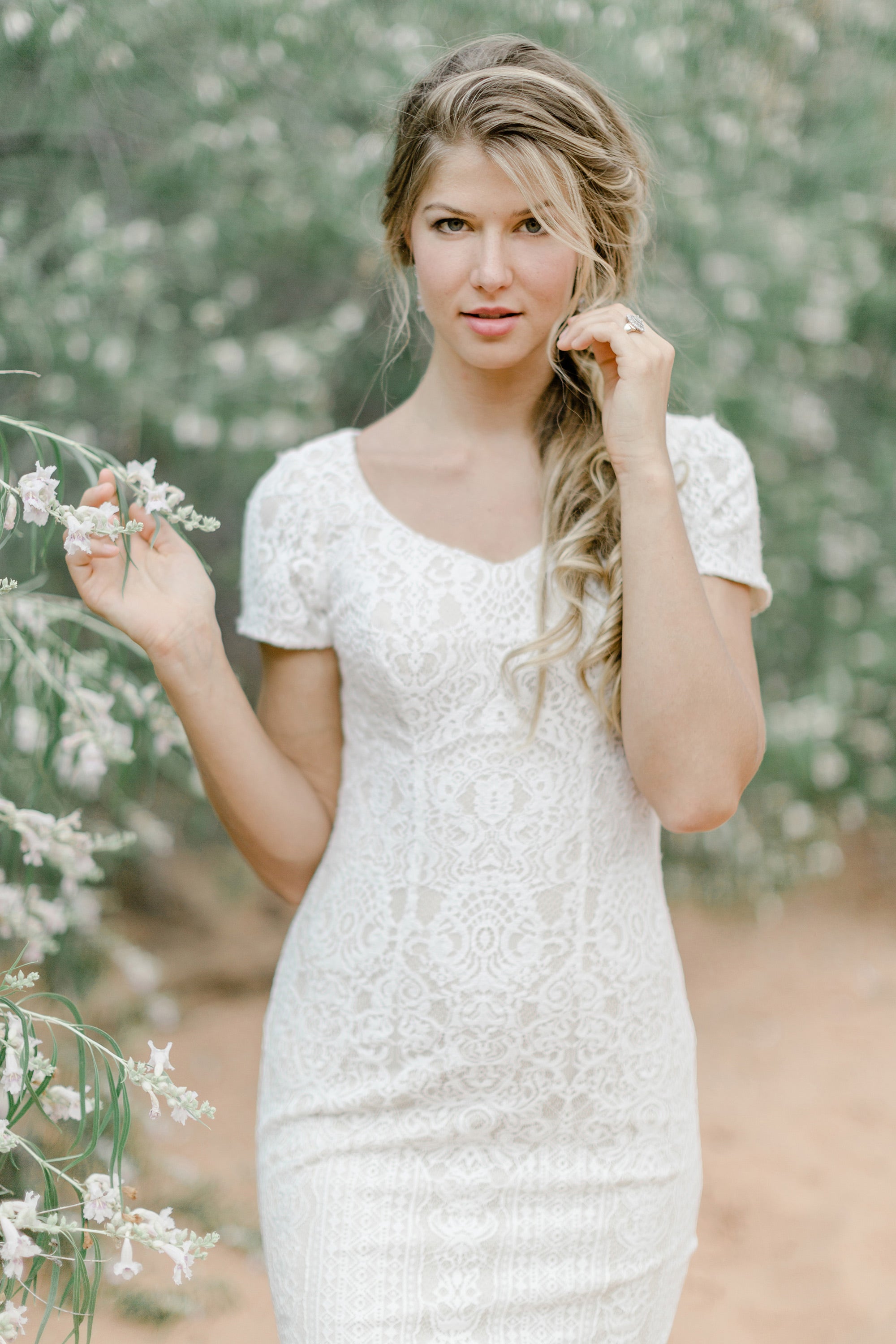 TR12024 LDS modest wedding dresses lace all over short sleeves fit and flare stretch lining bridal gown for plus size close front view