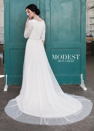 Mon Cheri TR21852 Modest Wedding Dress Back from A Closet Full of Dresses