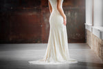 Mon Cheri TR21910 Modest Wedding Dress Close from A Closet Full of Dresses